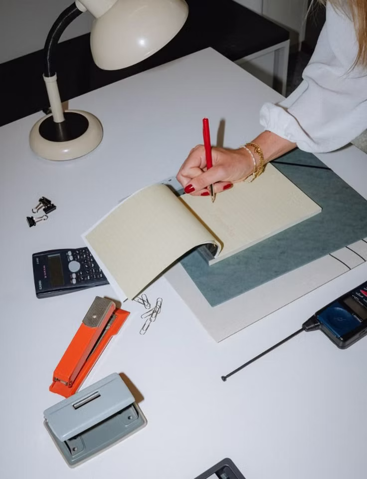 Design materials and creative tools arranged on a work table